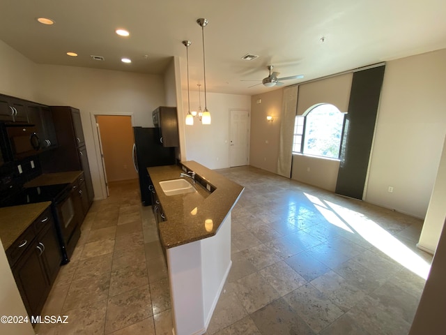 kitchen with ceiling fan, stainless steel refrigerator, sink, black electric range oven, and decorative light fixtures