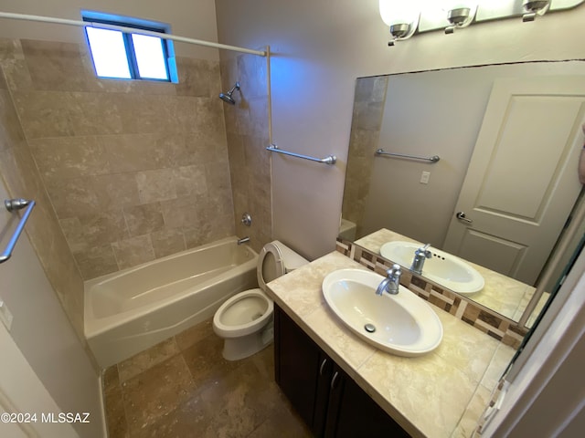 full bathroom featuring vanity, toilet, and tiled shower / bath combo