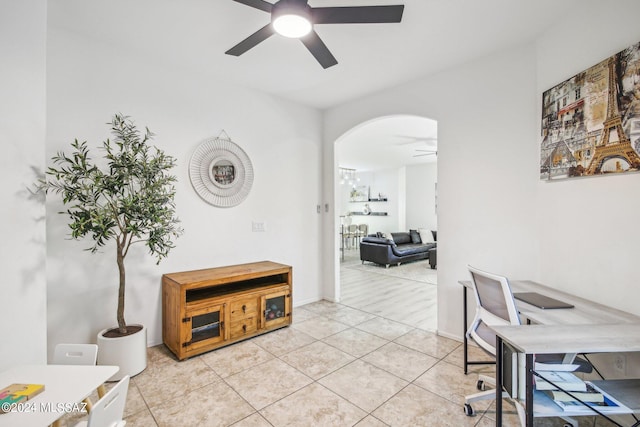 home office featuring light tile patterned flooring and ceiling fan