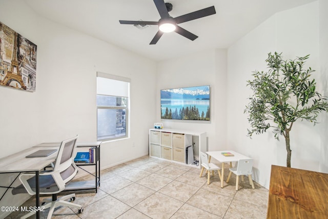 tiled office space featuring ceiling fan