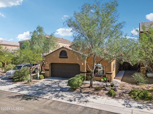 mediterranean / spanish-style house featuring a garage