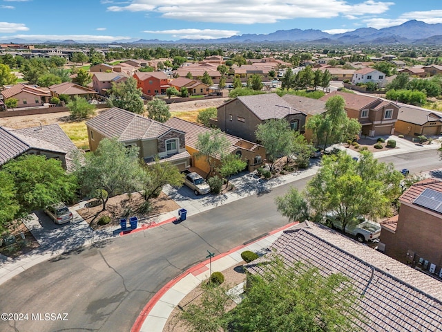 birds eye view of property featuring a mountain view