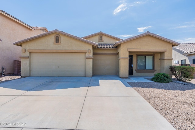 view of front of home with a garage