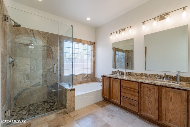 bathroom featuring separate shower and tub, vanity, and ceiling fan