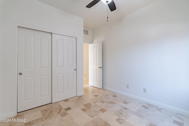 unfurnished bedroom with ceiling fan, baseboards, visible vents, and a closet