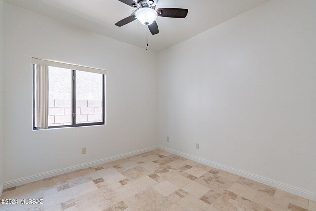 spare room featuring ceiling fan