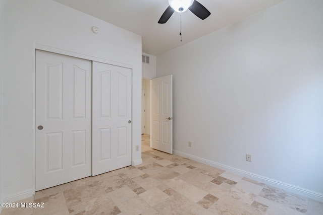 unfurnished bedroom with ceiling fan, baseboards, visible vents, and a closet