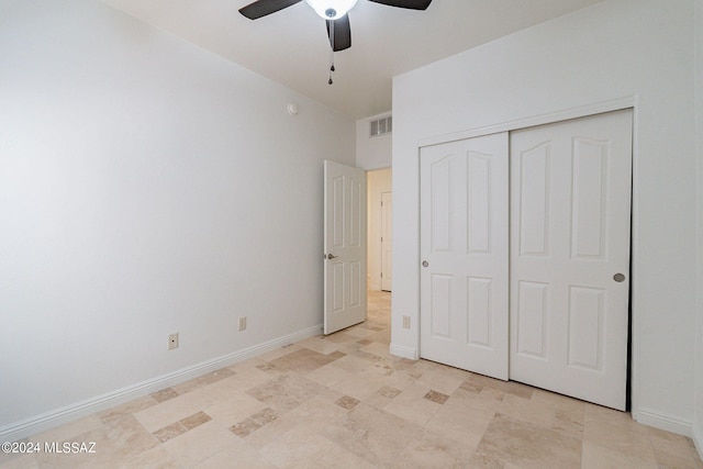 unfurnished bedroom featuring ceiling fan, baseboards, visible vents, and a closet
