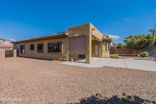 back of property with a patio area