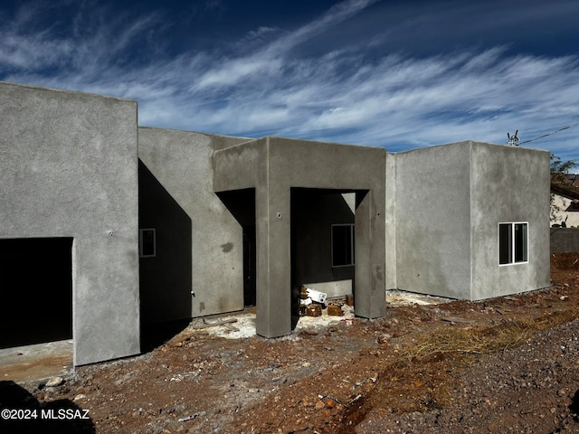 exterior space featuring stucco siding