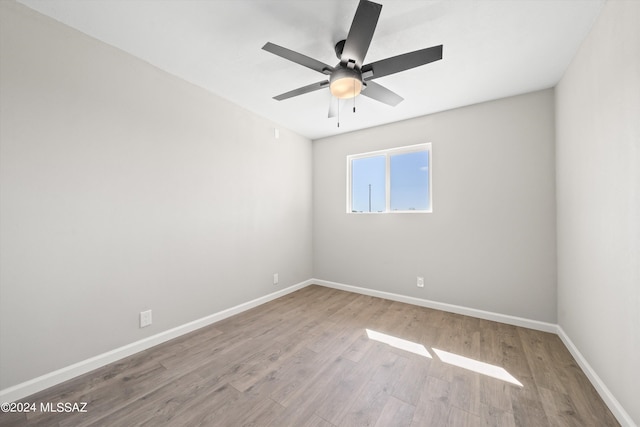 unfurnished room with ceiling fan and light hardwood / wood-style flooring