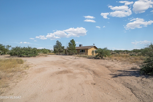 view of front of house with a rural view