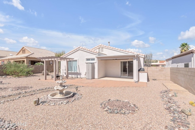 back of house featuring a pergola and a patio area