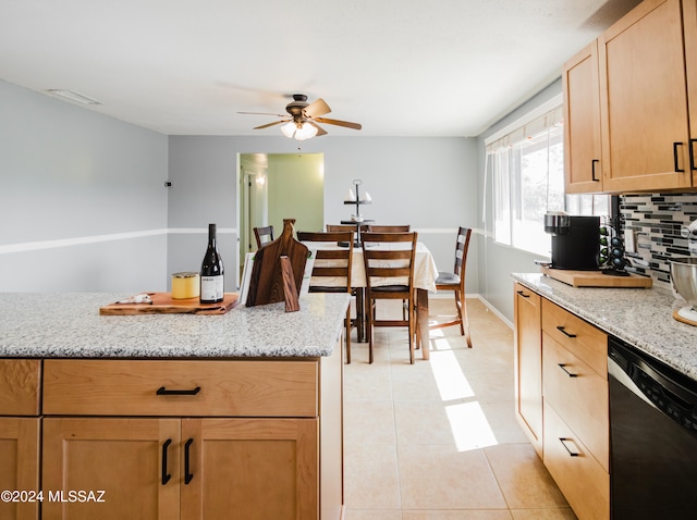 kitchen with dishwasher, backsplash, light stone counters, and light tile patterned floors