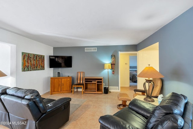 living room with light tile patterned floors