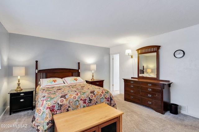 bedroom with light carpet