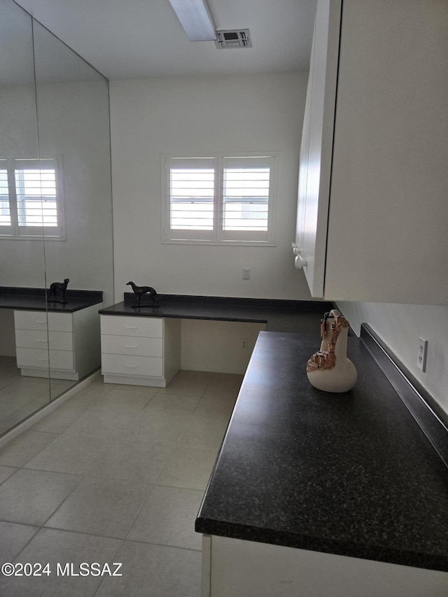 bathroom with tile patterned floors