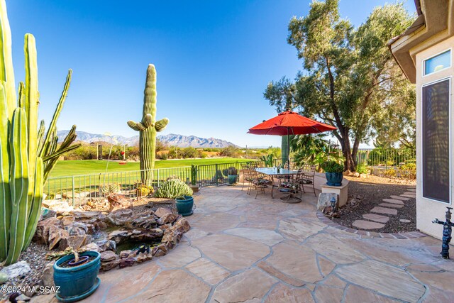 view of patio / terrace with a mountain view