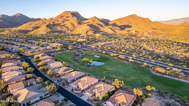 birds eye view of property with a mountain view