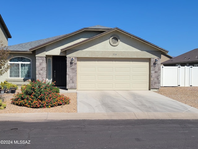 single story home featuring a garage