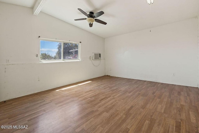 unfurnished room with vaulted ceiling with beams, a ceiling fan, wood finished floors, and an AC wall unit