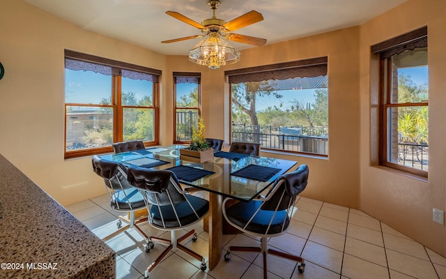 dining room featuring ceiling fan and light tile patterned floors