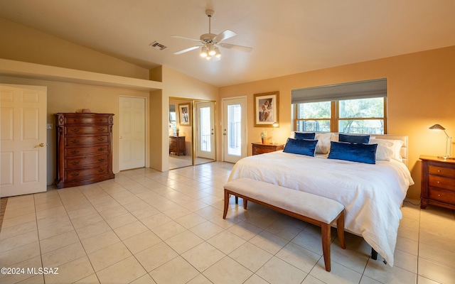 bedroom with ceiling fan, light tile patterned floors, and lofted ceiling