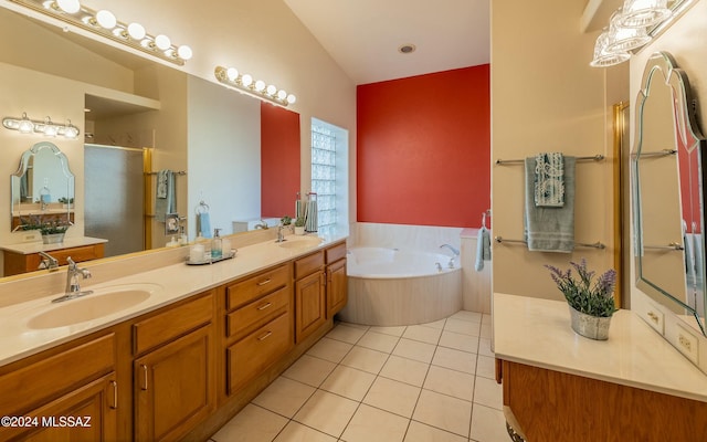 bathroom featuring tile patterned floors, separate shower and tub, vanity, and lofted ceiling