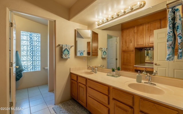 bathroom with tile patterned flooring and vanity