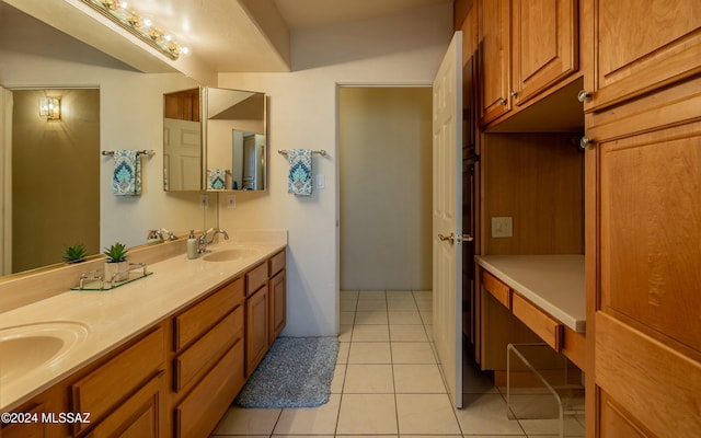 bathroom with tile patterned flooring and vanity