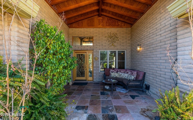 property entrance featuring outdoor lounge area and a patio