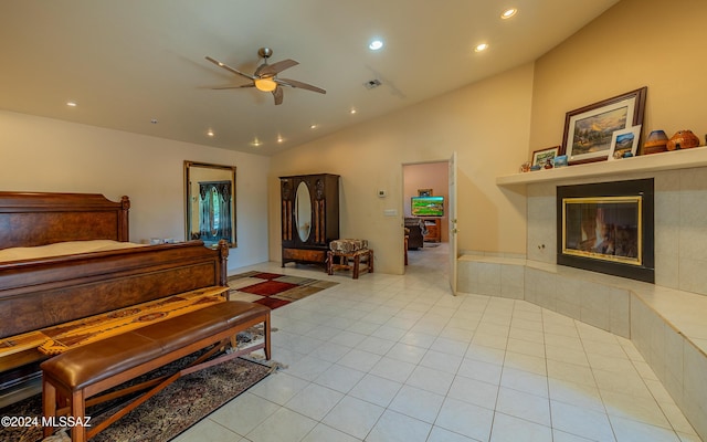 tiled bedroom with a fireplace and lofted ceiling