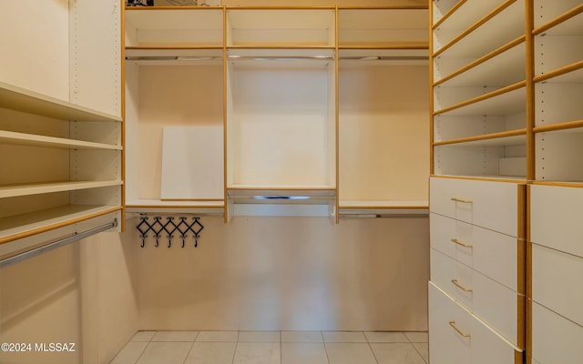 walk in closet featuring light tile patterned floors