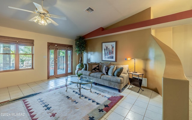 tiled living room featuring ceiling fan and vaulted ceiling