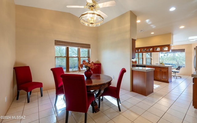 dining area with light tile patterned floors, plenty of natural light, and ceiling fan