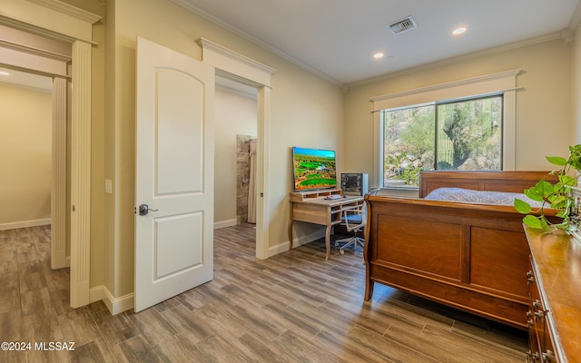 15251 N Dove Canyon Pass, Marana, AZ 85658 - bedroom with ornamental molding, baseboards, wood finished floors, recessed lighting, and a desk