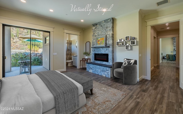 15251 N Dove Canyon Pass, Marana, AZ 85658 - bedroom with access to exterior, ornamental molding, baseboards, wood finished floors, and a stone fireplace