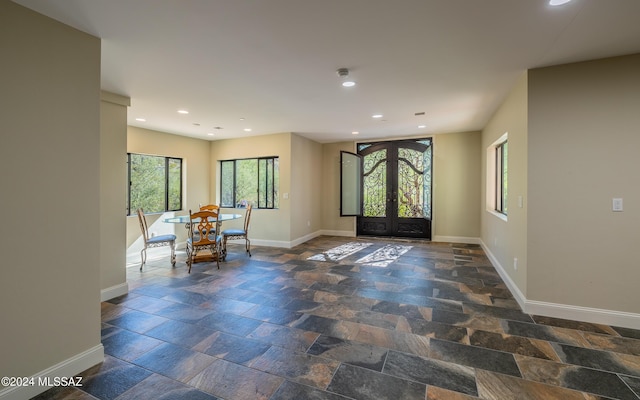 15251 N Dove Canyon Pass, Marana, AZ 85658 - entryway with baseboards, stone tile flooring, french doors, and recessed lighting