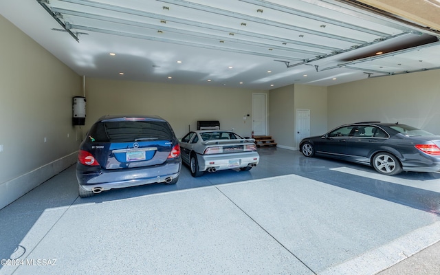 15251 N Dove Canyon Pass, Marana, AZ 85658 - garage featuring baseboards, recessed lighting, and a central vacuum unit