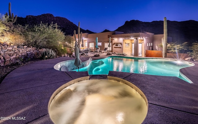 15251 N Dove Canyon Pass, Marana, AZ 85658 - pool at twilight with a patio and a pool with connected hot tub