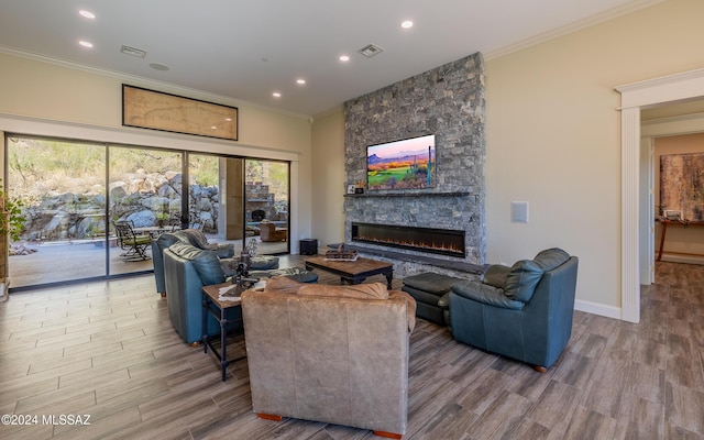 15251 N Dove Canyon Pass, Marana, AZ 85658 - living room with a fireplace, wood finished floors, ornamental molding, recessed lighting, and baseboards