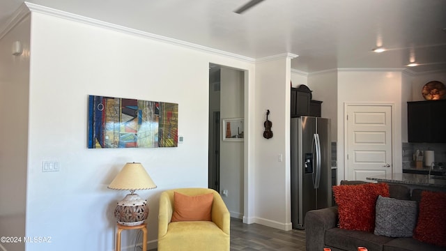 living room with dark hardwood / wood-style floors and crown molding