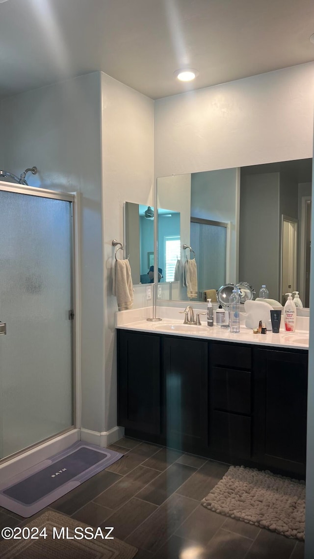 bathroom with vanity and an enclosed shower