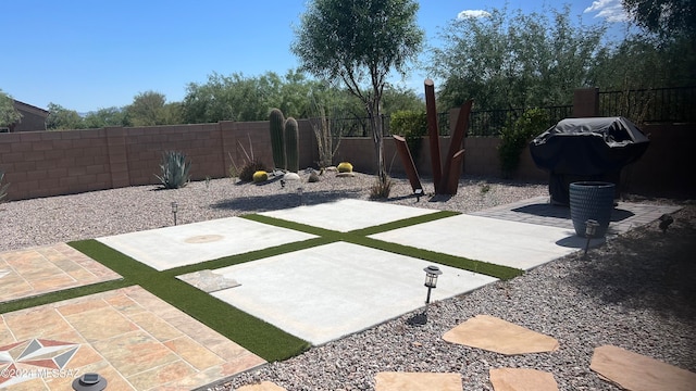 view of patio featuring a grill