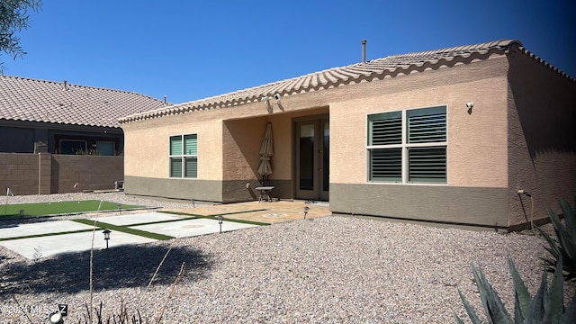 back of house with a patio area