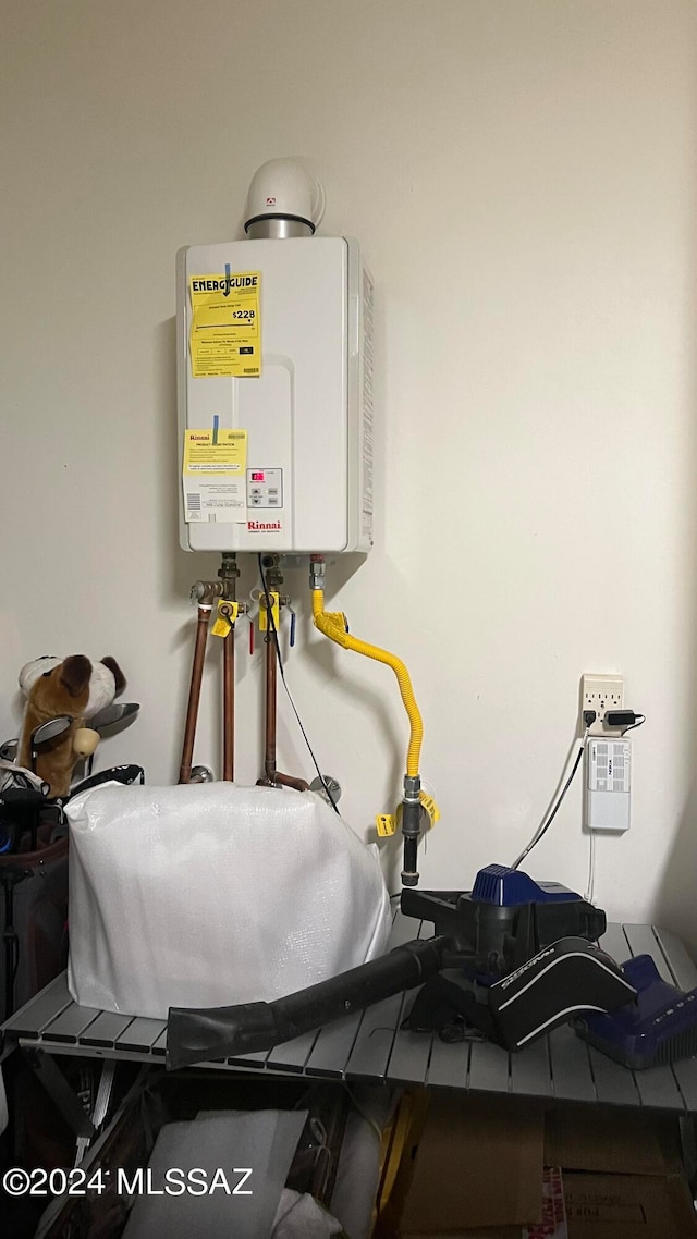 utility room featuring tankless water heater