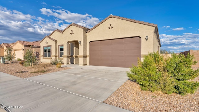 mediterranean / spanish-style house featuring a garage