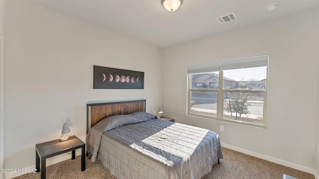 bedroom featuring light colored carpet