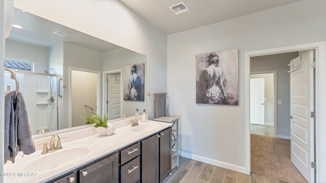 bathroom with walk in shower and vanity