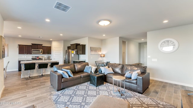 living room with light hardwood / wood-style flooring